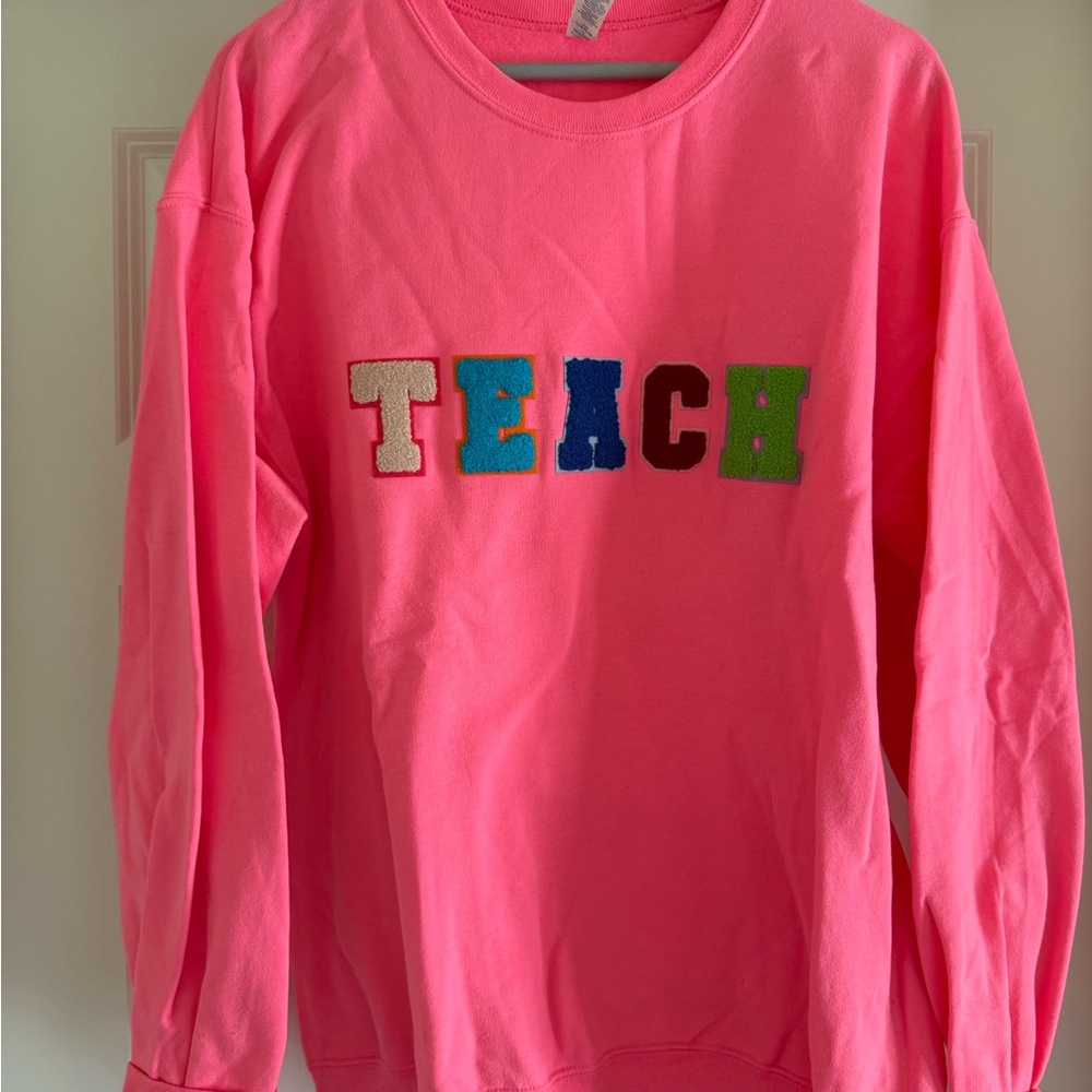 Pink Womens Sweatshirt with 'TEACH' Design